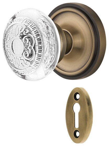 Classic Rosette Mortise-Lock Set with Egg and Dart Crystal-Glass Knobs in Antique Brass.
